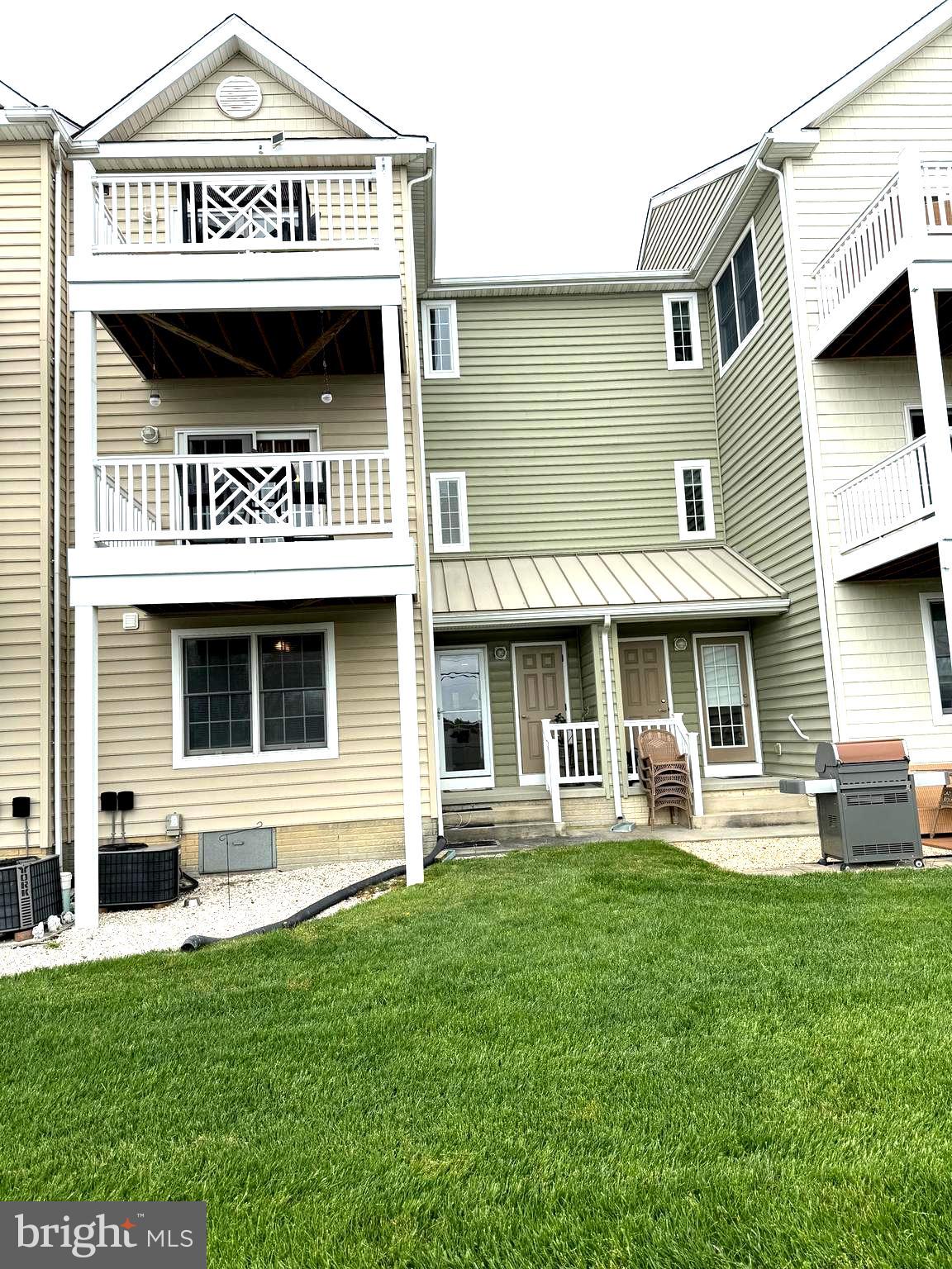 9823 Golf Course Road, Unit 20 Ocean City, MD 21842 - Photo 20 of 61 a view of a house with a yard