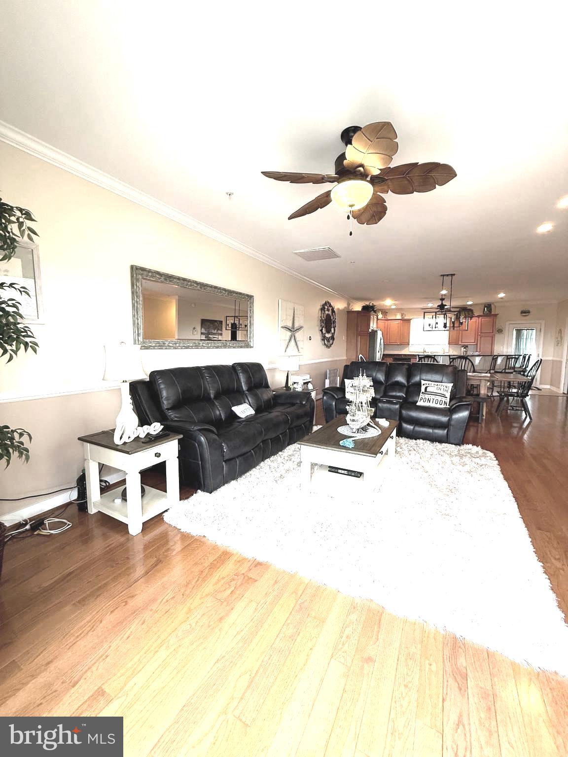 9823 Golf Course Road, Unit 20 Ocean City, MD 21842 - Photo 28 of 61 a living room with furniture and kitchen view