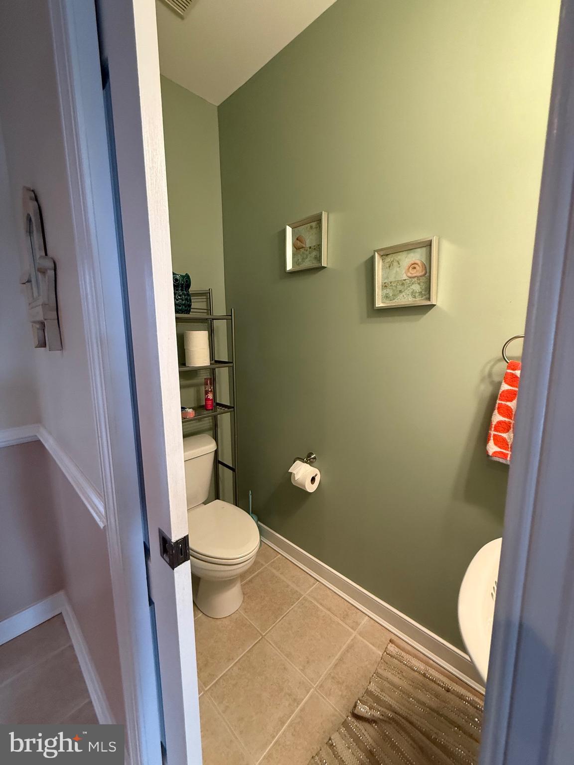 9823 Golf Course Road, Unit 20 Ocean City, MD 21842 - Photo 34 of 61 powder room off kitchen w/ pocket door