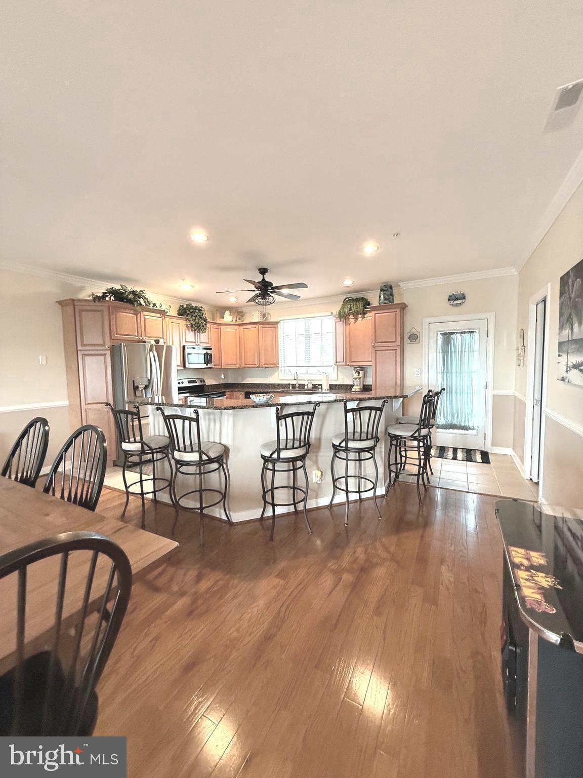 9823 Golf Course Road, Unit 20 Ocean City, MD 21842 - Photo 36 of 61 a living room with furniture and a table