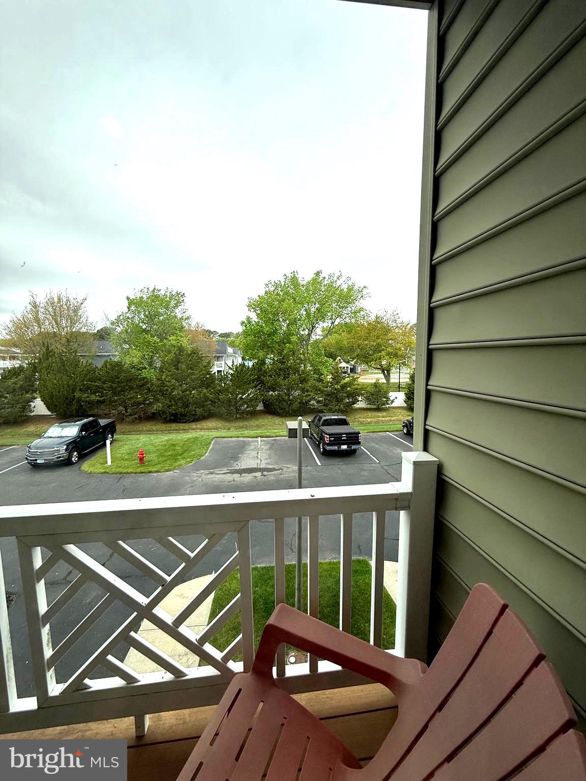 9823 Golf Course Road, Unit 20 Ocean City, MD 21842 - Photo 37 of 61 a view of a balcony with floor to ceiling windows