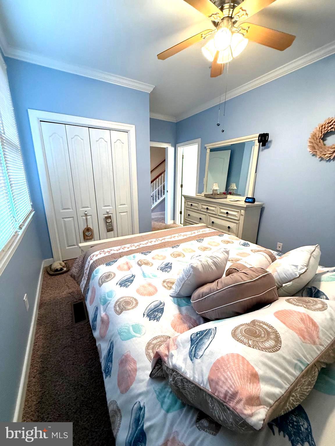 9823 Golf Course Road, Unit 20 Ocean City, MD 21842 - Photo 38 of 61 a bedroom with a bed and a mirror