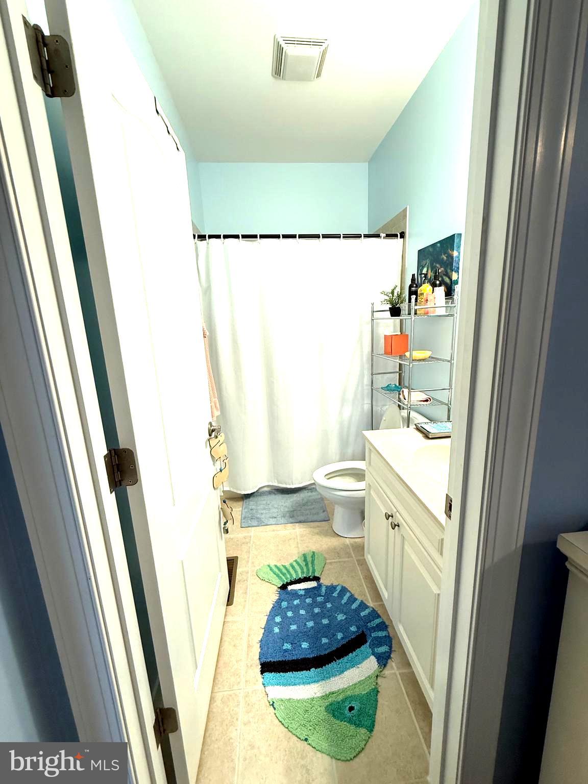 9823 Golf Course Road, Unit 20 Ocean City, MD 21842 - Photo 39 of 61 a bathroom with sink and a mirror