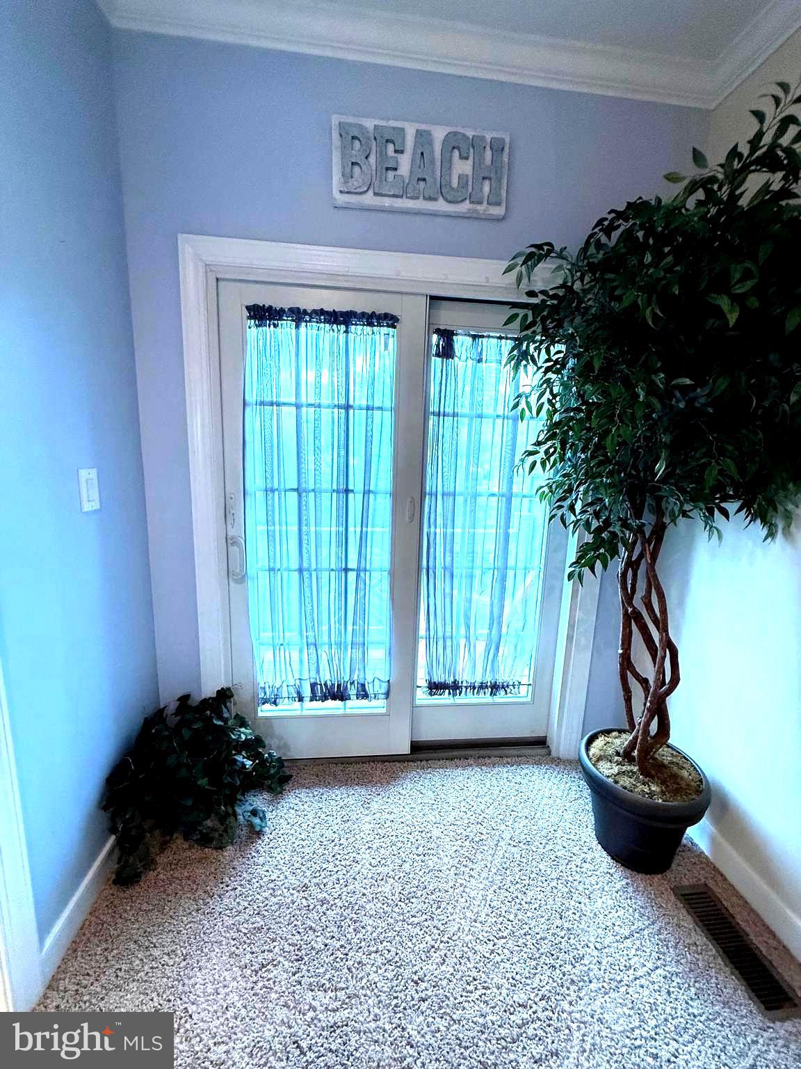 9823 Golf Course Road, Unit 20 Ocean City, MD 21842 - Photo 42 of 61 a view of a entryway door of a house