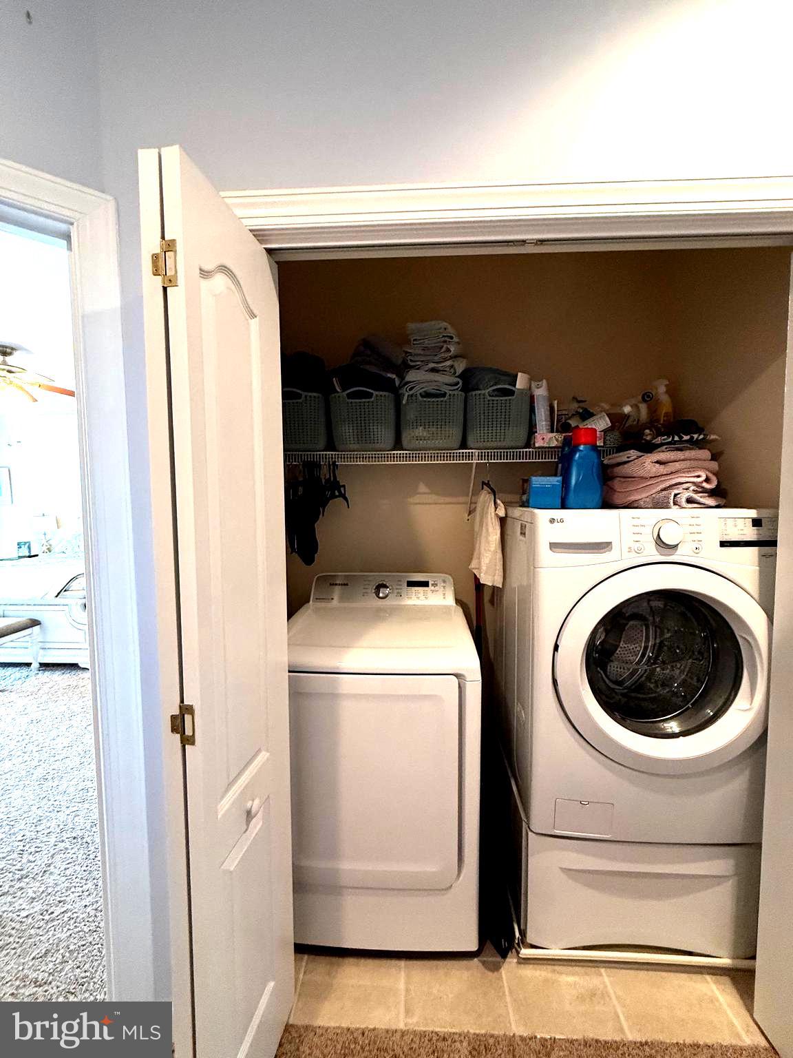 9823 Golf Course Road, Unit 20 Ocean City, MD 21842 - Photo 43 of 61 a utility room with dryer and washer