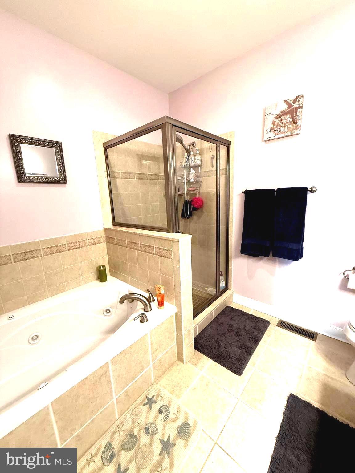 9823 Golf Course Road, Unit 20 Ocean City, MD 21842 - Photo 47 of 61 a bathroom with a tub a sink and a view of living room