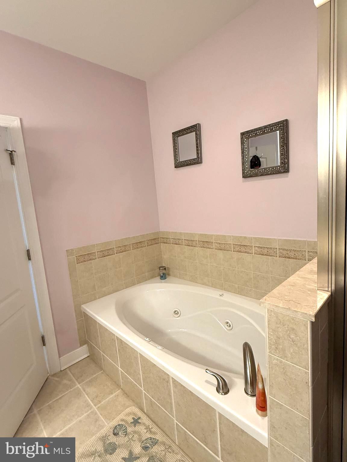 9823 Golf Course Road, Unit 20 Ocean City, MD 21842 - Photo 49 of 61 a bathroom with a bathtub and a shower