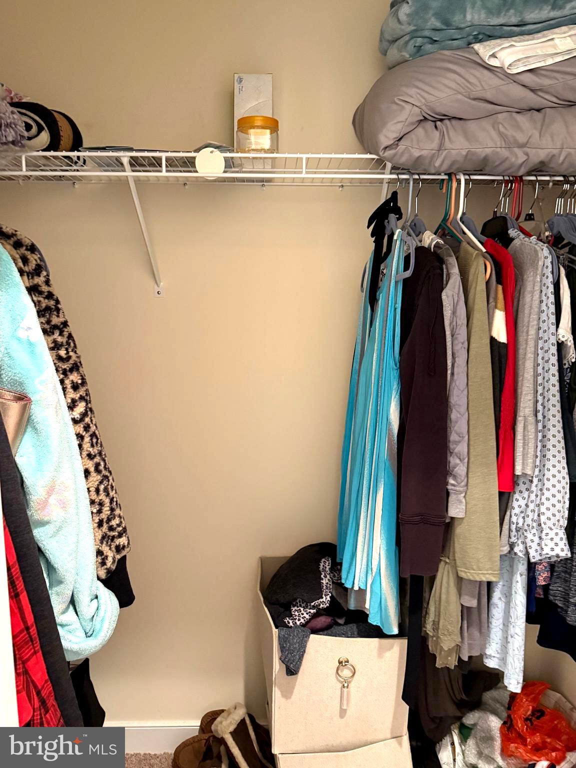 9823 Golf Course Road, Unit 20 Ocean City, MD 21842 - Photo 50 of 61 a view of walk in closet with clothes and shoes