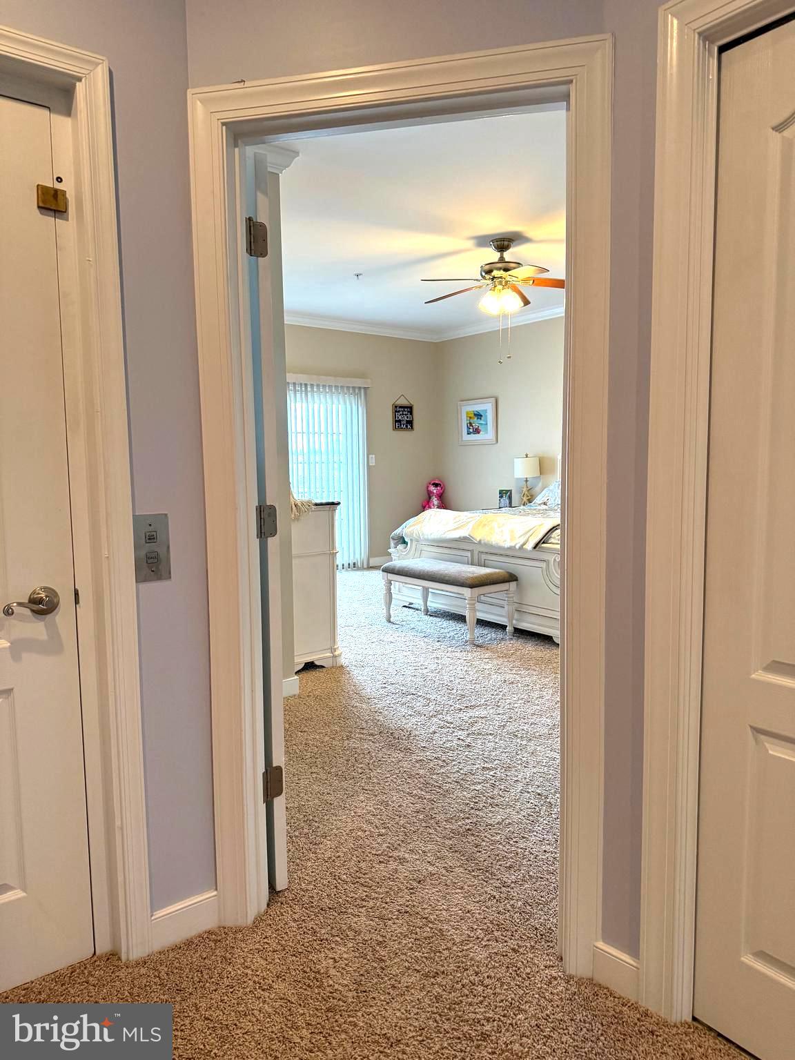 9823 Golf Course Road, Unit 20 Ocean City, MD 21842 - Photo 53 of 61 a bedroom with a bed and a view of en suite bathroom
