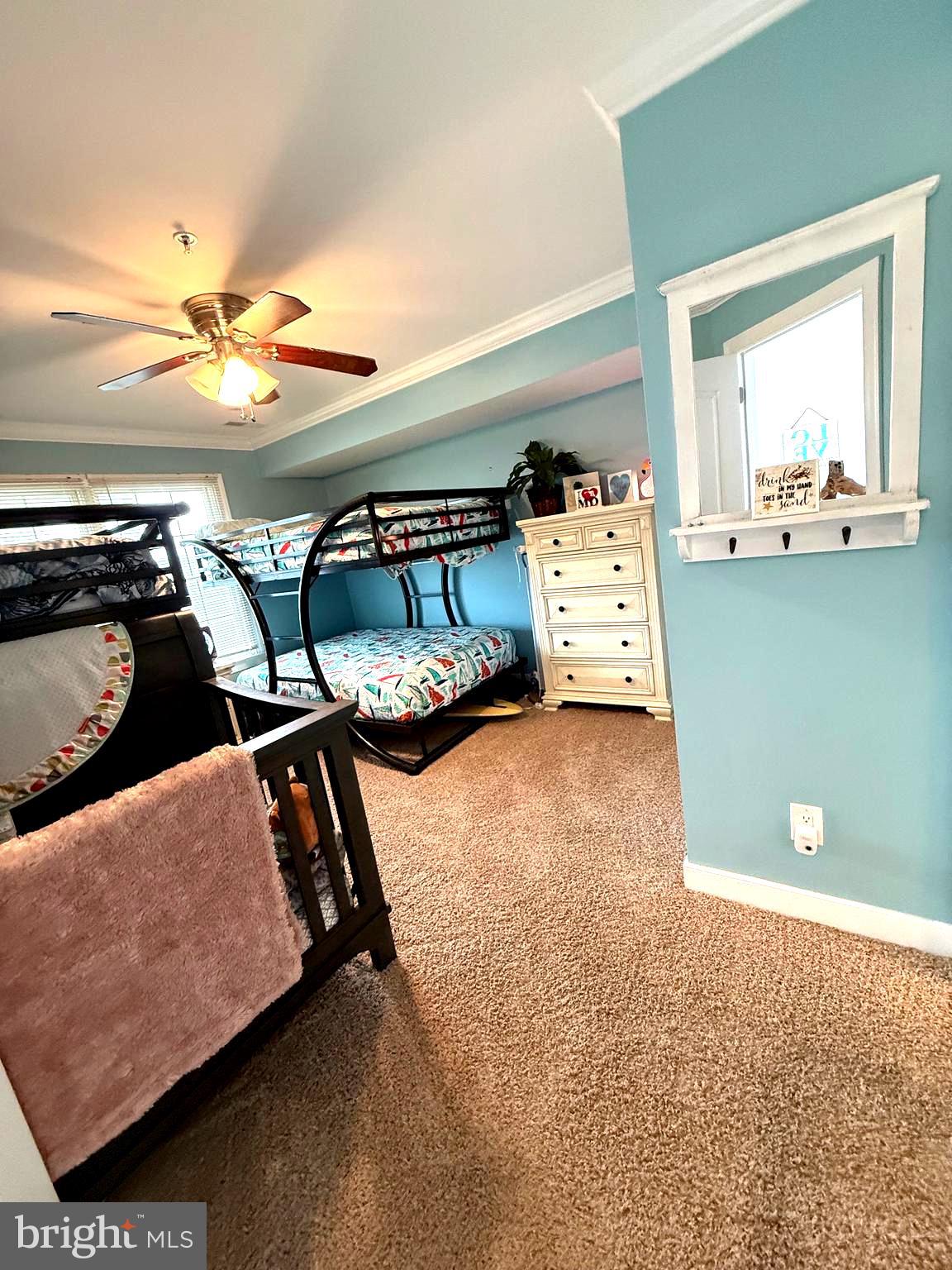 9823 Golf Course Road, Unit 20 Ocean City, MD 21842 - Photo 8 of 61 a view of room with furniture and a ceiling fan