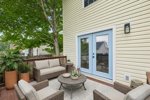 a view of a house with backyard and porch
