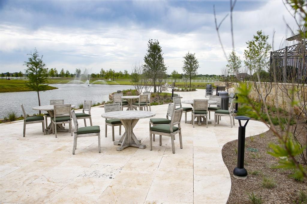 1429 Eclipse Road Aubrey, TX 76227 - Photo 34 of 37 View of patio / terrace featuring outdoor dining space and a water view