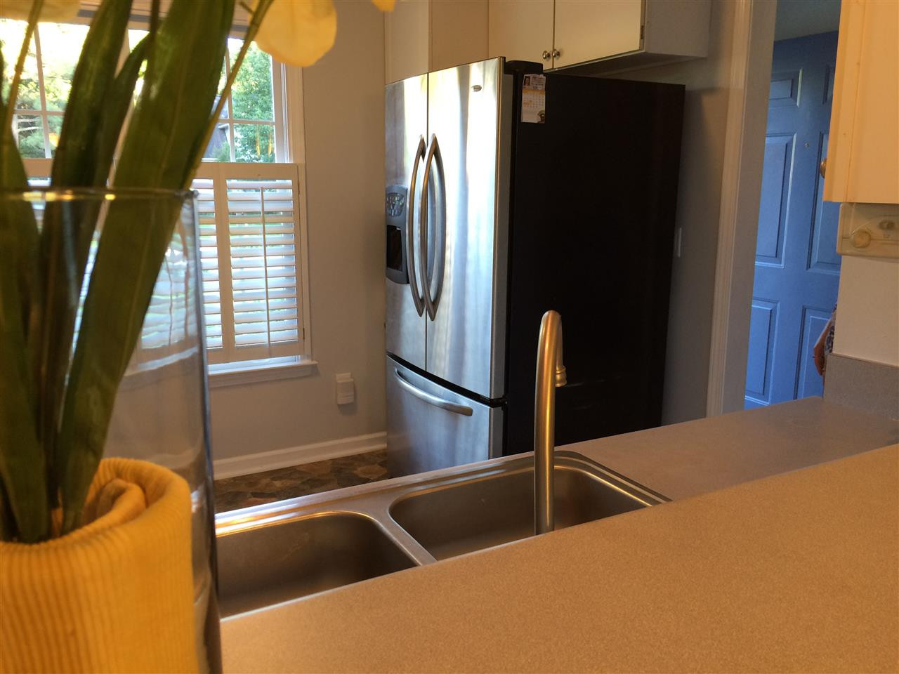 515 Windcrest Road Durham, NC 27713 - Photo 6 of 15 Stainless fridge stays! Check out the plantation shutters.