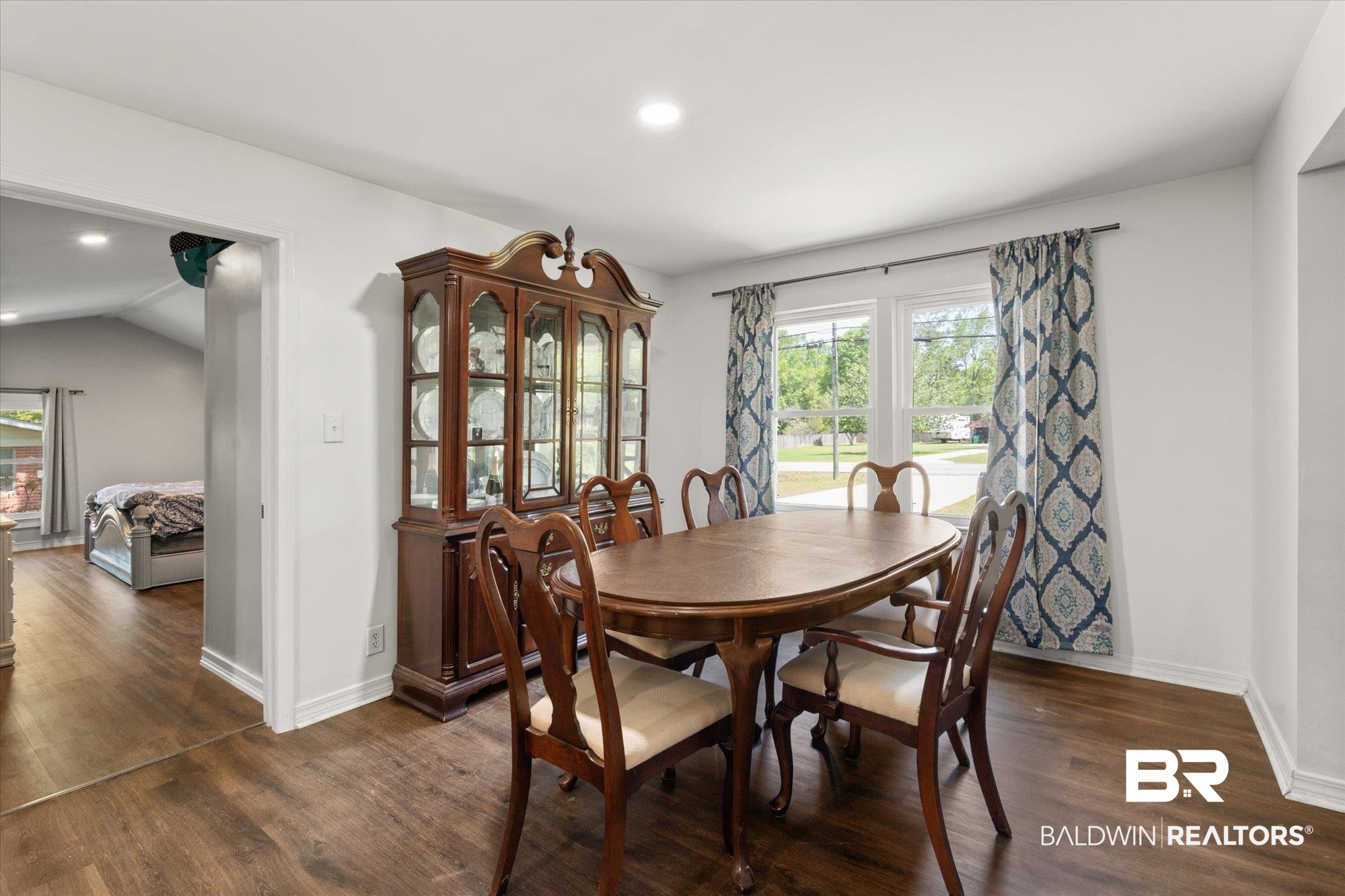 529 Cleveland Road Saraland, AL 36571 - Photo 10 of 31 Dining space with dark wood-style flooring, baseboards, and recessed lighting