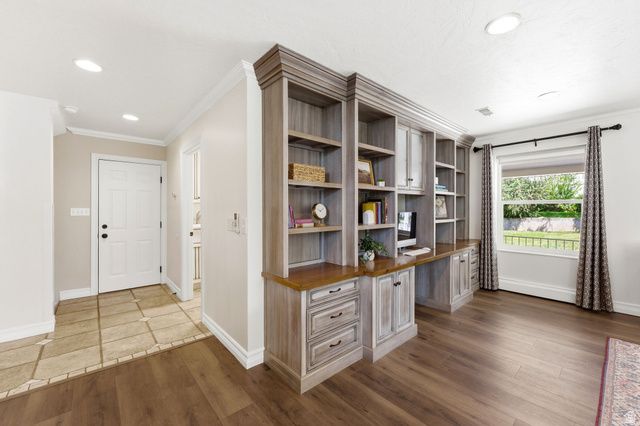720 East Center Street Bountiful, UT 84010 - Photo 22 of 83 Great shelving in family room with a view to the garage door straight ahead and laundry to the right
