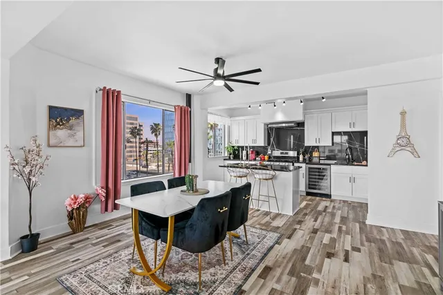 a kitchen with granite countertop a sink stove and refrigerator
