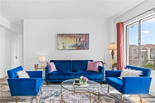 a living room with furniture and a large window