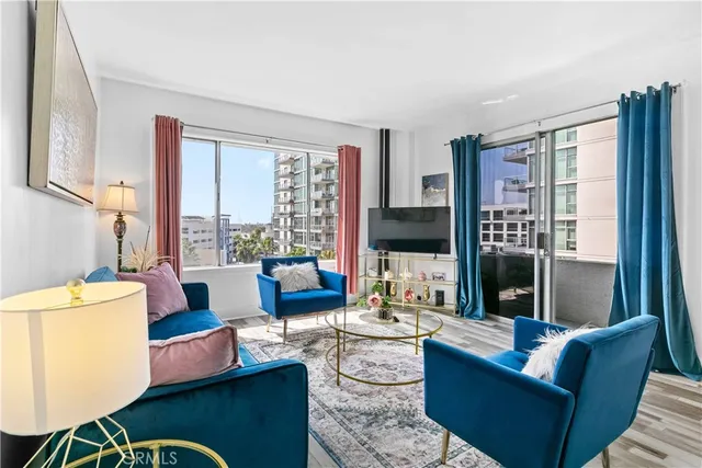 a living room with furniture and a large window