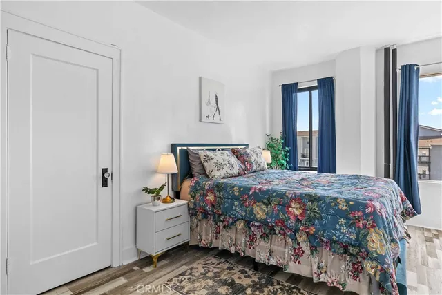 a bedroom with bed and window