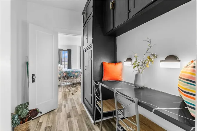 a view of living room with furniture and wooden floor