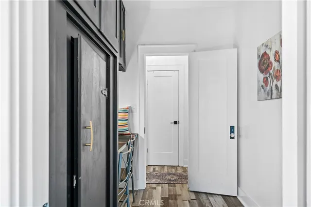 a view of a hallway with paintings on the wall