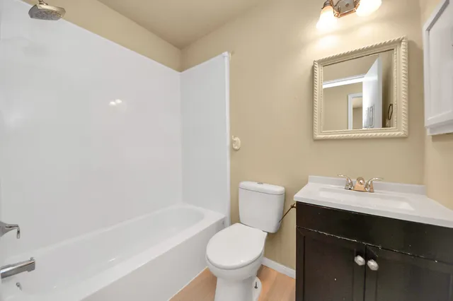 a bathroom with a sink toilet and vanity