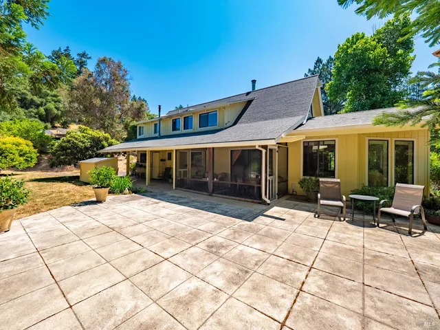a view of house with outdoor sitting space