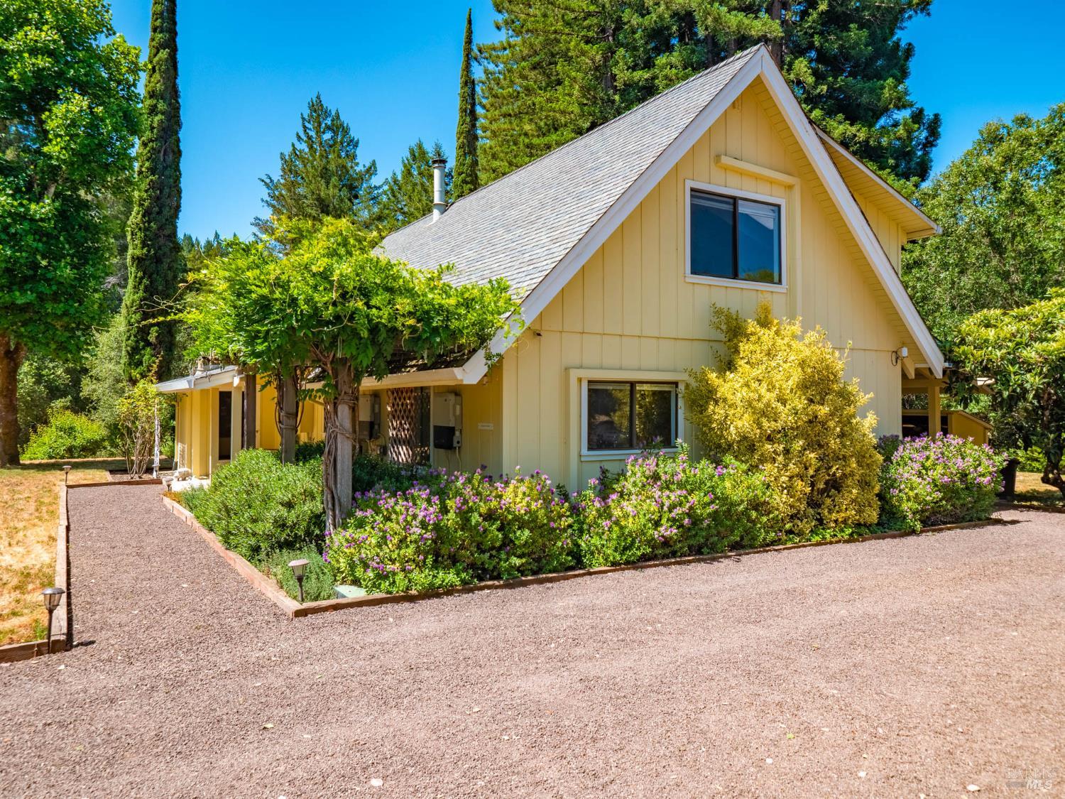 2151 Highway 128 Philo, CA 95466 - Photo 2 of 55 a front view of a house with a yard and trees