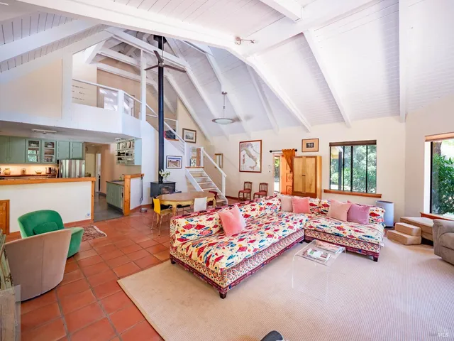 a living room with furniture and a rug