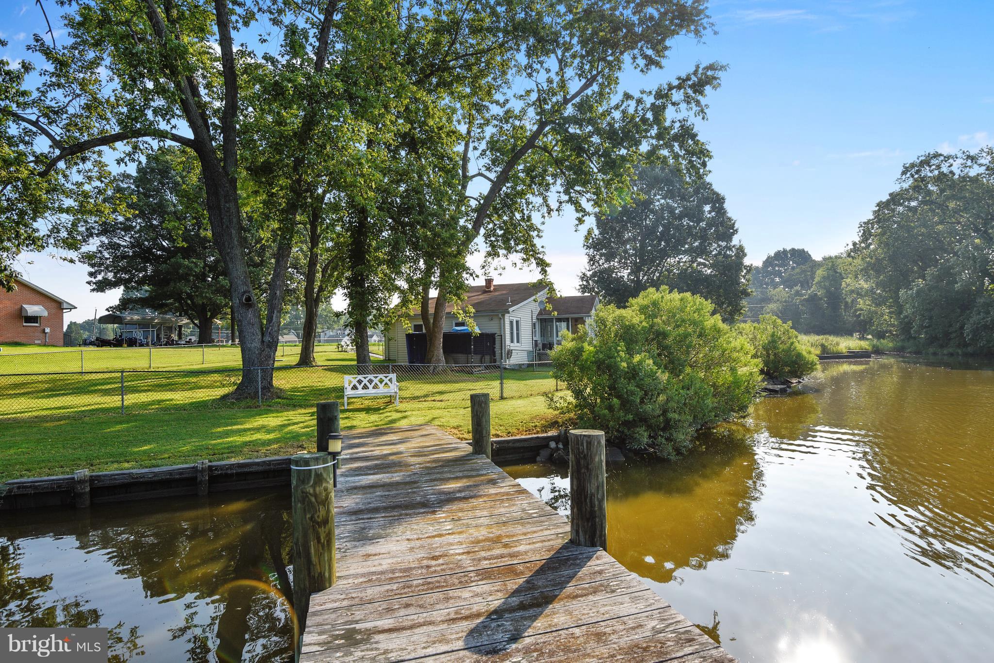 a view of a lake with a house in the background