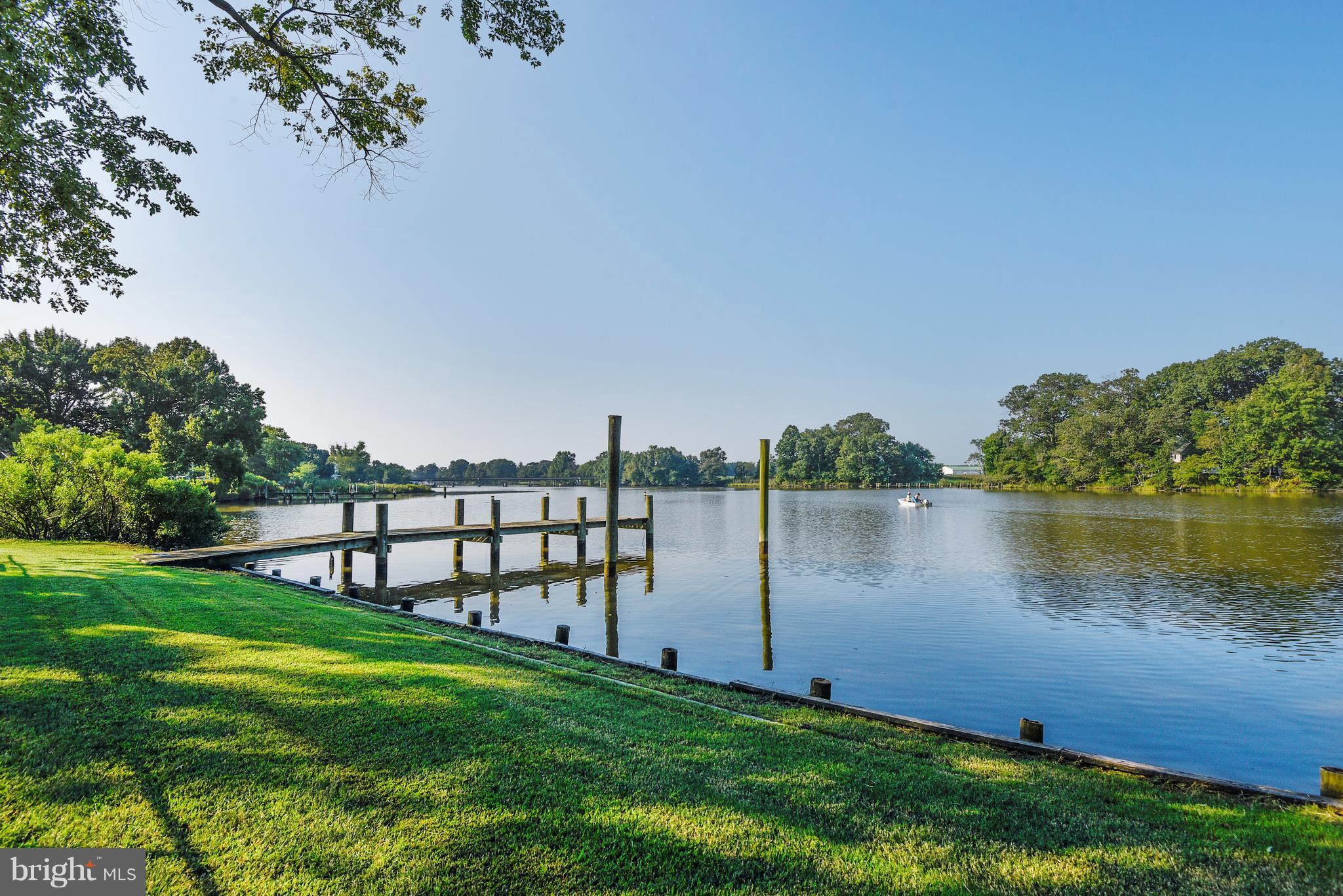 5734 Swamp Circle Road Deale, MD 20751 - Photo 2 of 30 a view of a lake with houses in the background