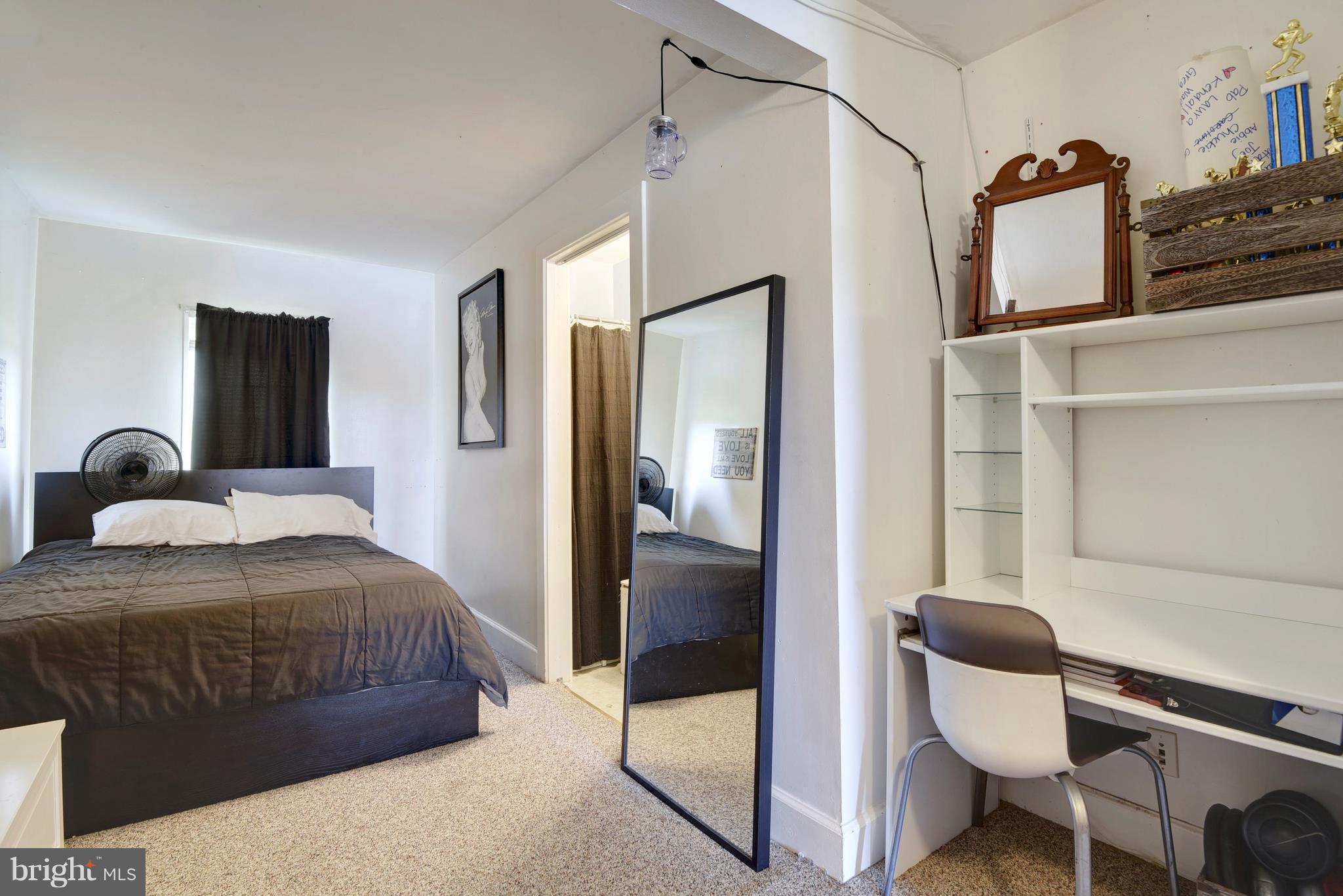5734 Swamp Circle Road Deale, MD 20751 - Photo 20 of 30 a bedroom with a bed and glass door