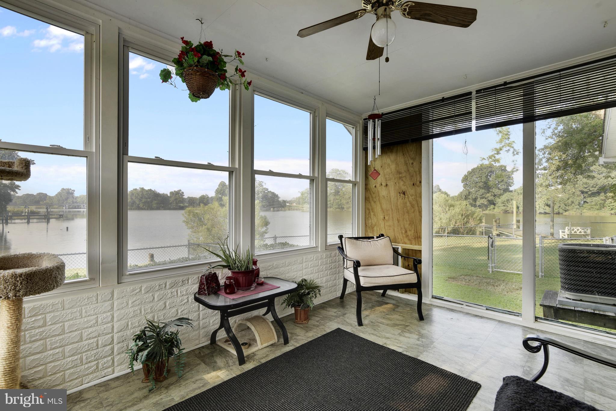 5734 Swamp Circle Road Deale, MD 20751 - Photo 3 of 30 a living room with furniture and a large window