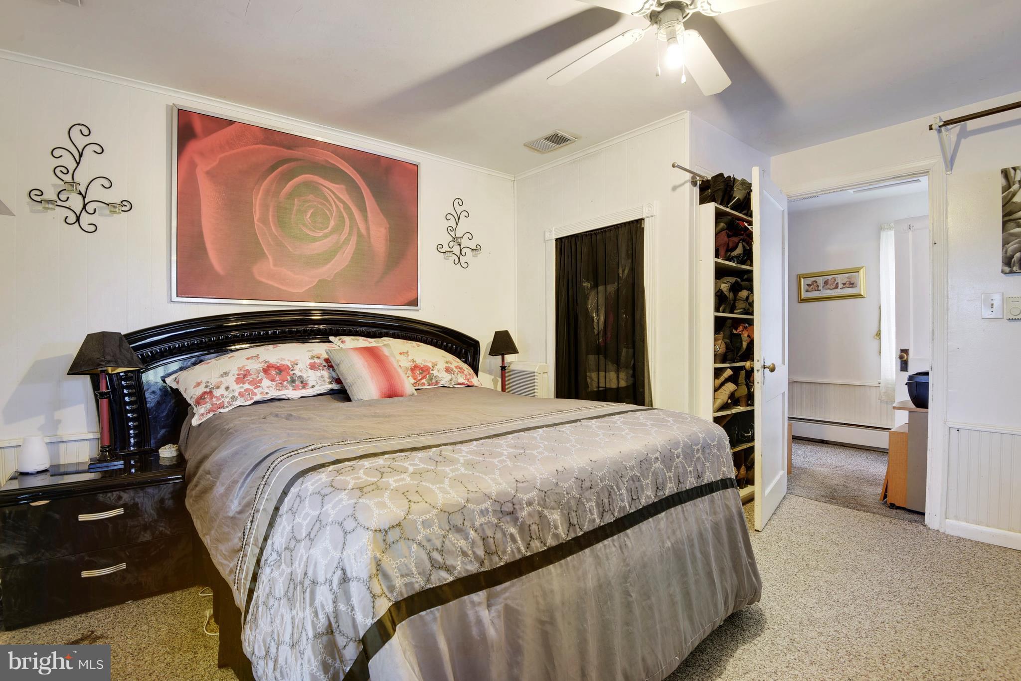 5734 Swamp Circle Road Deale, MD 20751 - Photo 24 of 30 a bedroom with a bed and closet