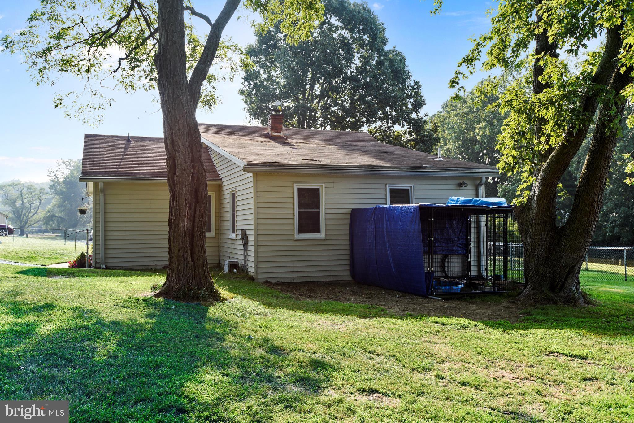 5734 Swamp Circle Road Deale, MD 20751 - Photo 29 of 30 a view of a house with a backyard