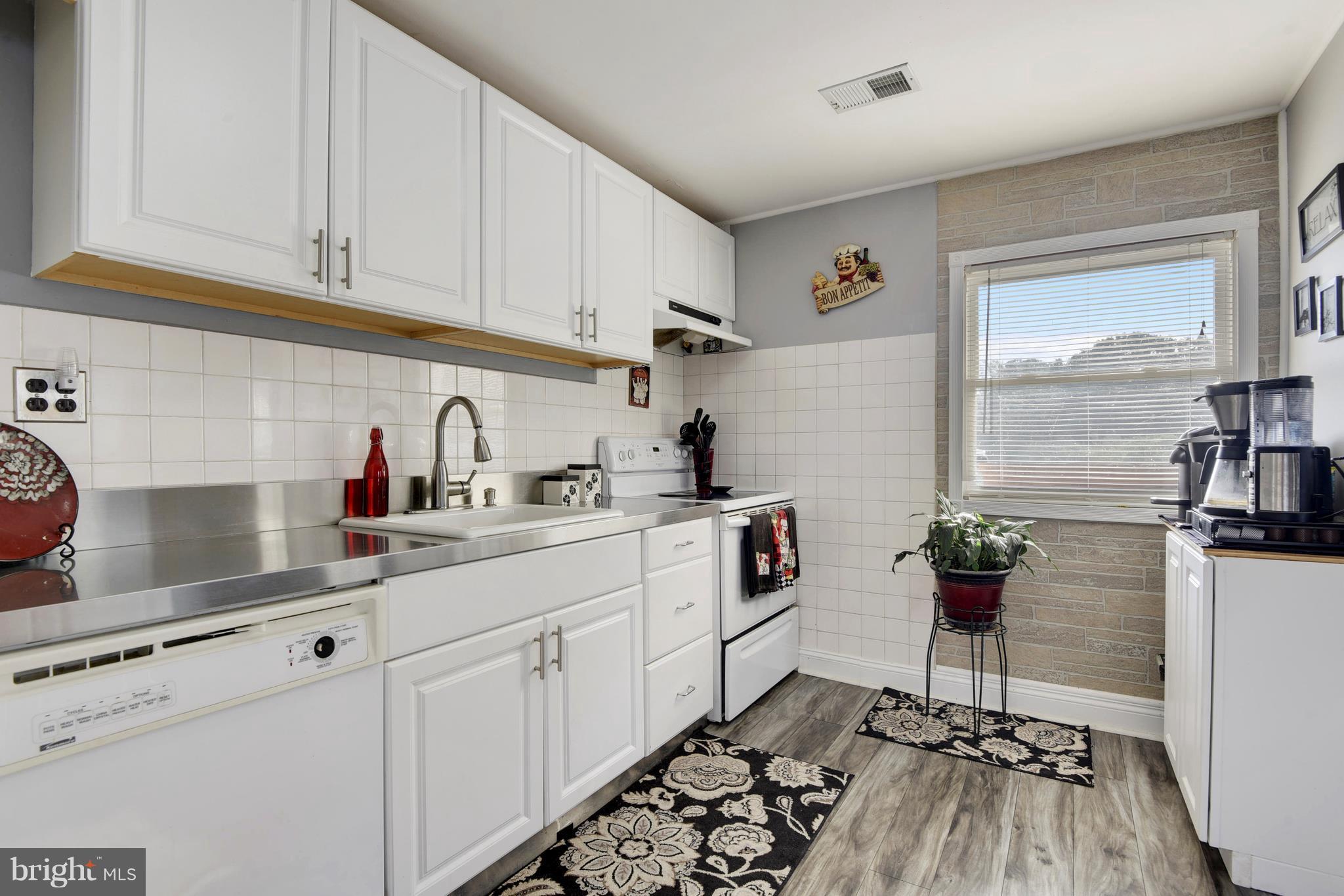 5734 Swamp Circle Road Deale, MD 20751 - Photo 9 of 30 a kitchen with a sink cabinets and window
