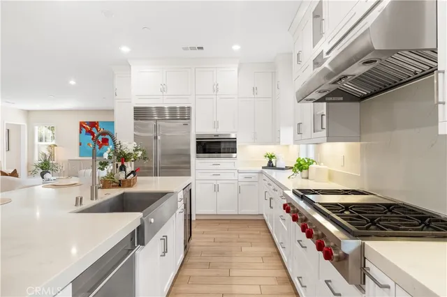 a kitchen with a stove and a sink