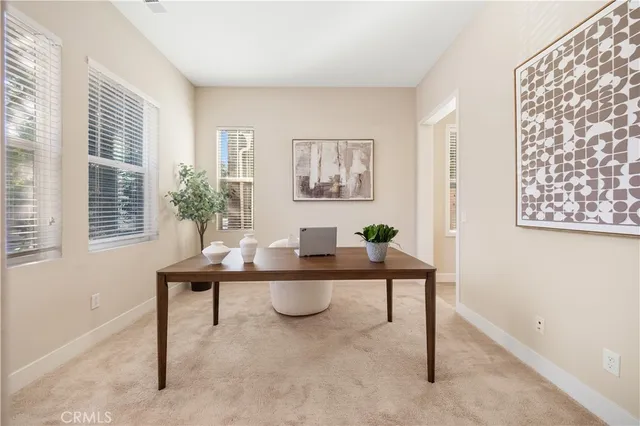 a work room with furniture and a window
