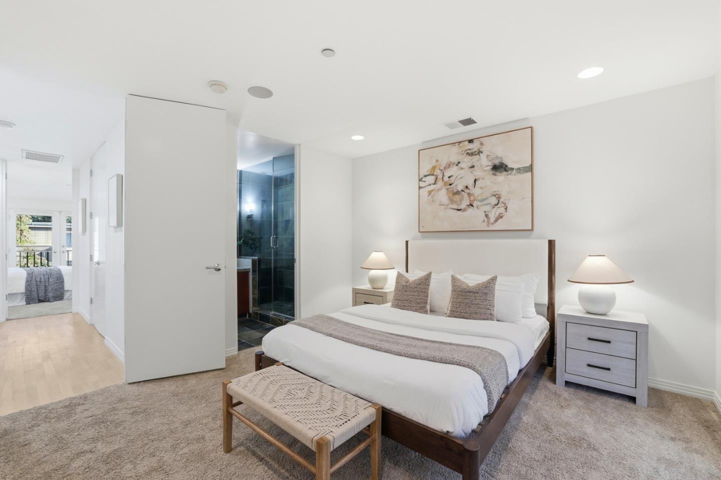 1835 Palm View Place, Unit 105 Santa Clara, CA 95050 - Photo 17 of 49 a bedroom with a bed and a painting on the wall