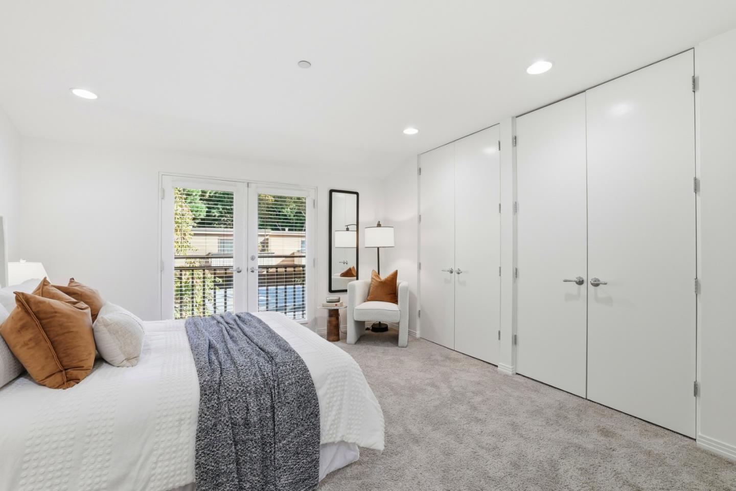 1835 Palm View Place, Unit 105 Santa Clara, CA 95050 - Photo 22 of 49 a bedroom with a large bed and three large window