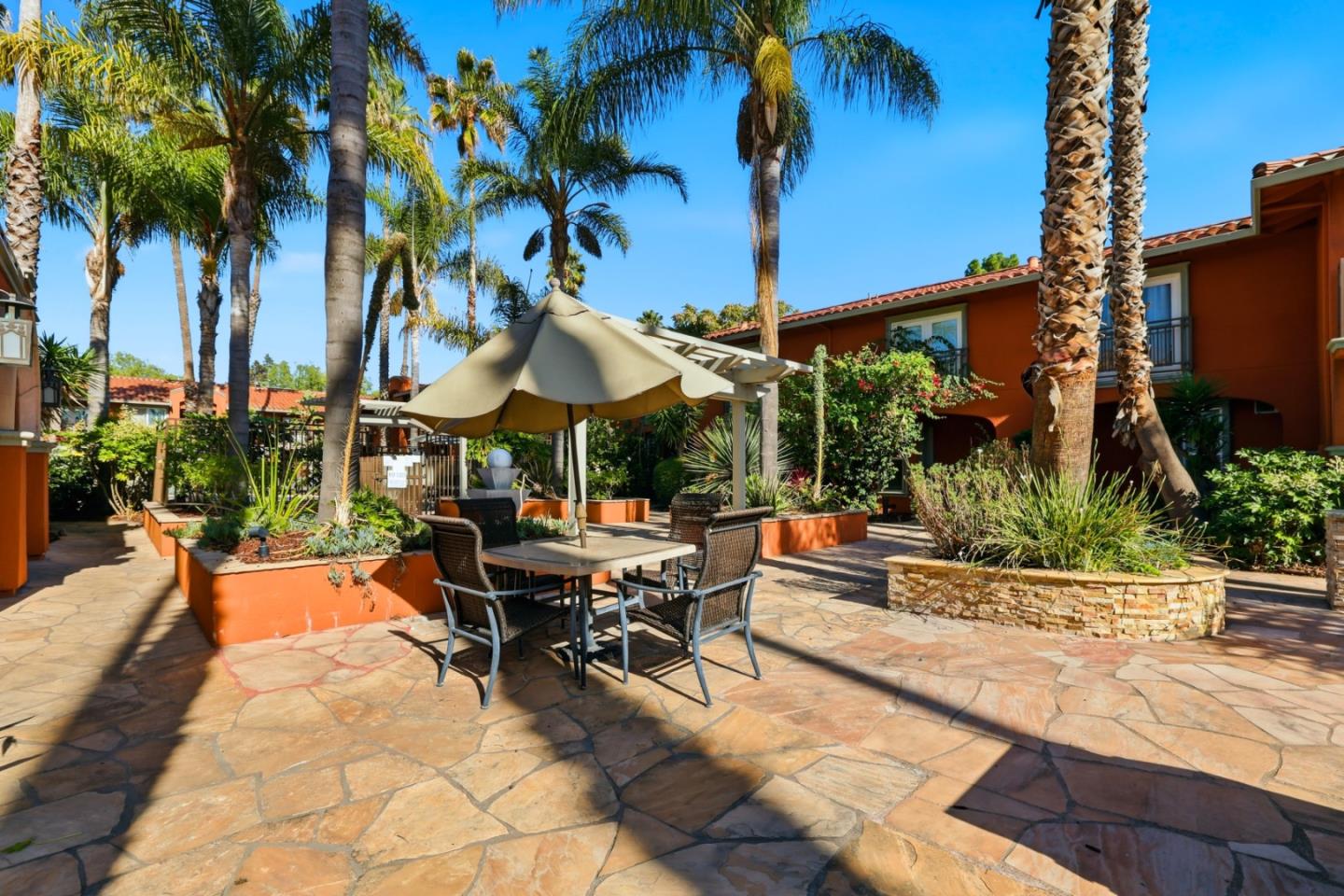 1835 Palm View Place, Unit 105 Santa Clara, CA 95050 - Photo 30 of 49 a view of a patio with swimming pool table and chairs
