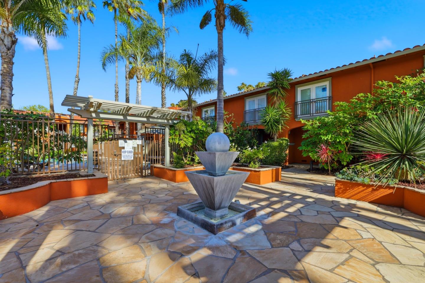 1835 Palm View Place, Unit 105 Santa Clara, CA 95050 - Photo 38 of 49 a view of a house with fountain and a patio