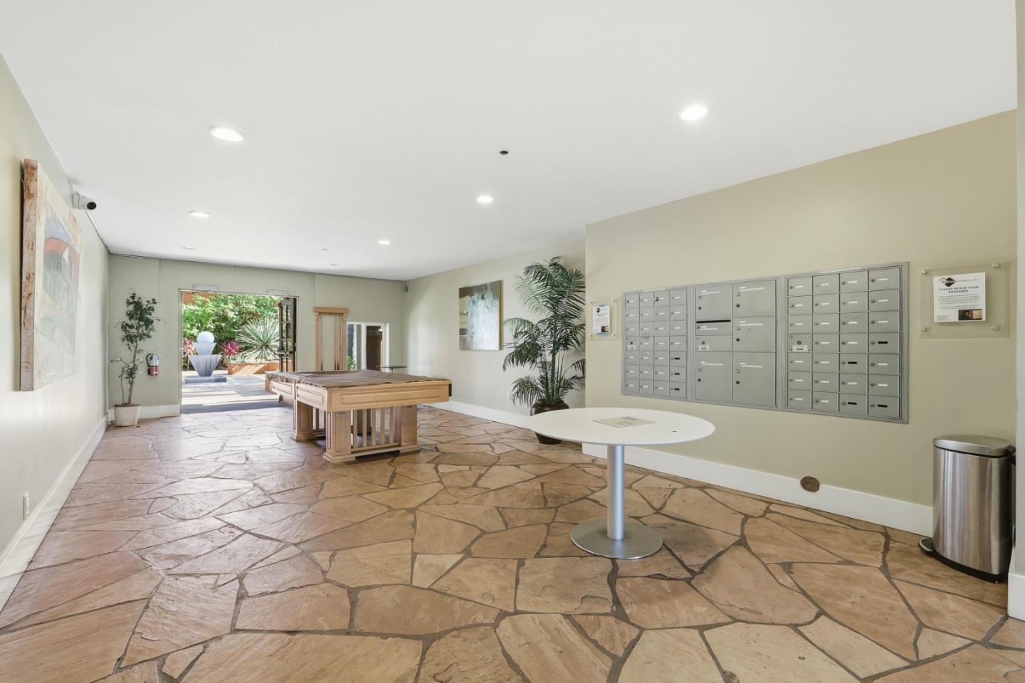 1835 Palm View Place, Unit 105 Santa Clara, CA 95050 - Photo 42 of 49 a living room with furniture and a table