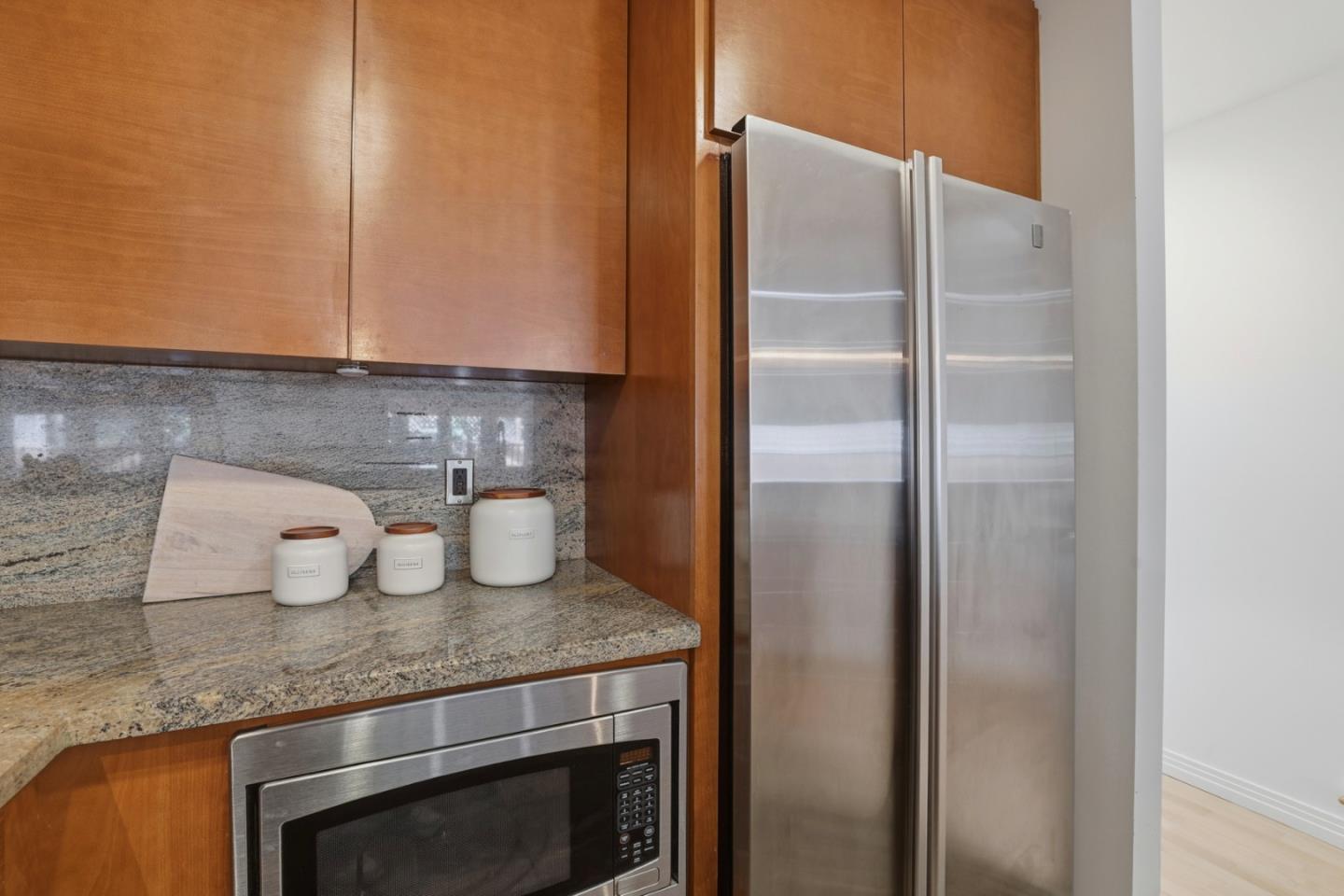 1835 Palm View Place, Unit 105 Santa Clara, CA 95050 - Photo 10 of 49 a kitchen with a refrigerator and cabinets