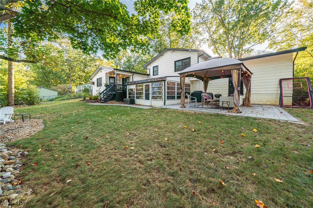 595 Moorfield Road Fairlawn, OH 44313 - Photo 44 of 50 Rear view of house with a gazebo, a patio, view of scattered trees, and stairs