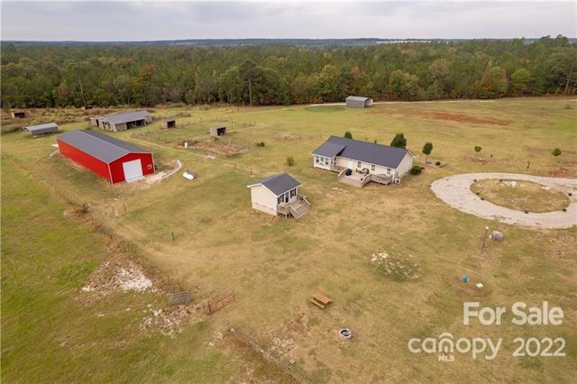 945 Field Trial Road Camden, SC 29020 - Photo 19 of 19 a view of a swimming pool and lounge chair