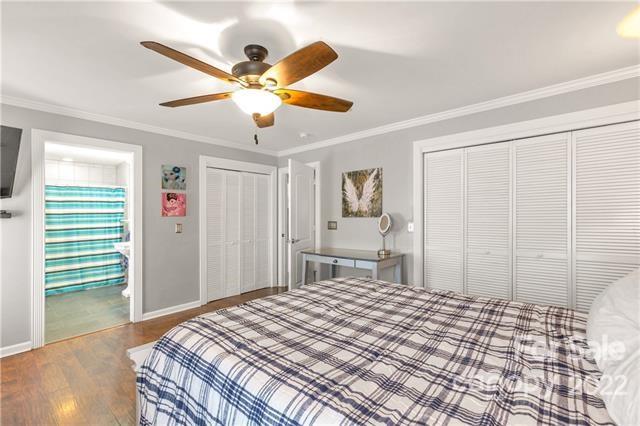 945 Field Trial Road Camden, SC 29020 - Photo 7 of 19 a bedroom with a bed and a chandelier