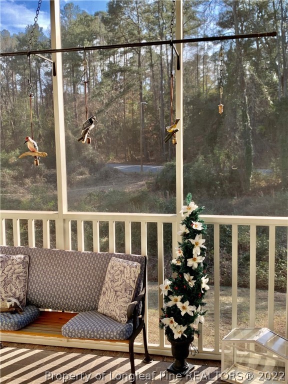 2651 Lockwood Road Fayetteville, NC 28303 - Photo 14 of 18 a view of a balcony with a potted plant