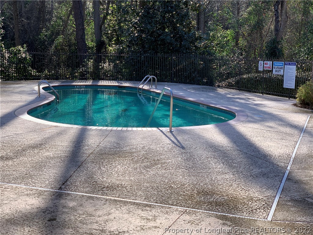 2651 Lockwood Road Fayetteville, NC 28303 - Photo 16 of 18 a view of a swimming pool with a yard