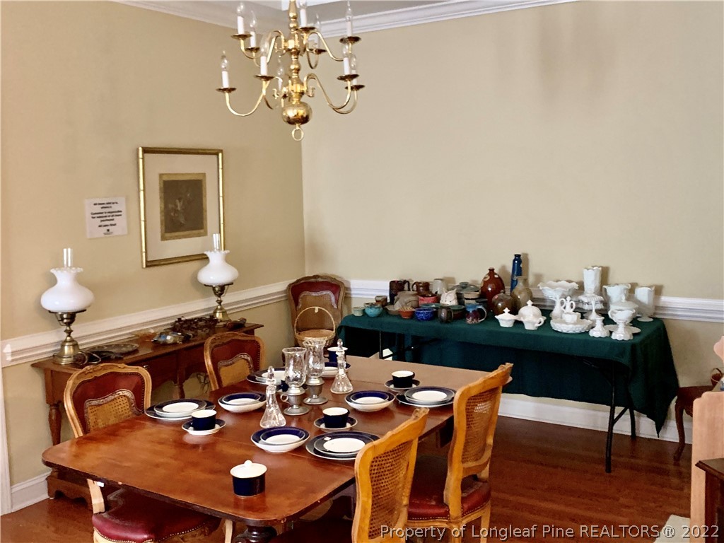2651 Lockwood Road Fayetteville, NC 28303 - Photo 6 of 18 a view of a dining room with furniture and chandelier